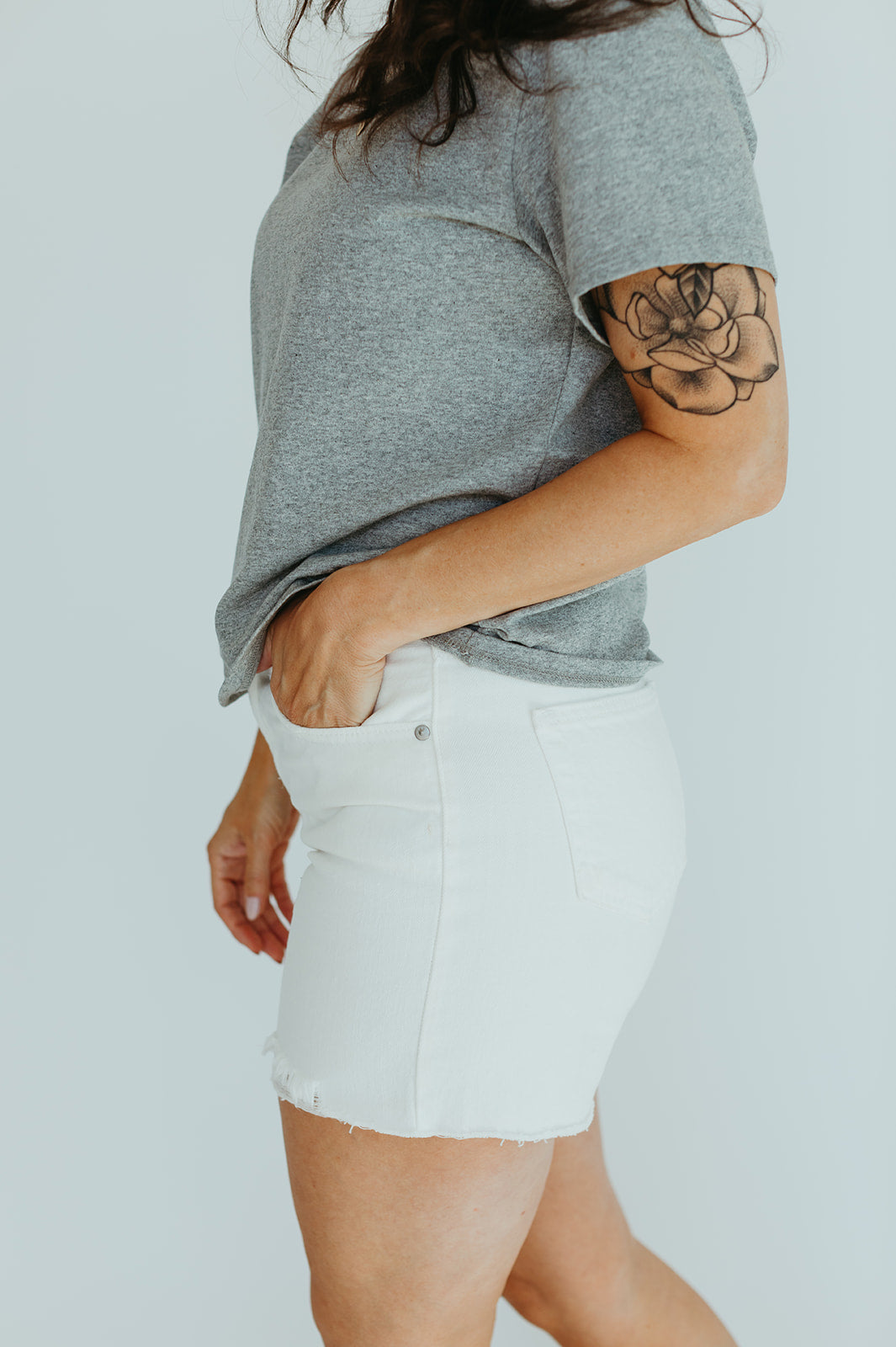 white_cotton_high_rise_jean_shorts_distressed
